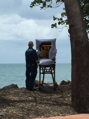 Ambulance crew dying woman beach goodbye