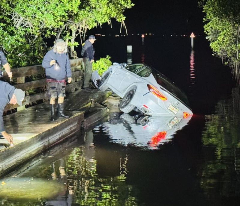 Ace News Today - Teen narrowly misses two people fishing as she crashes her car into the Indian River Lagoon. IMage credit: IRCSO